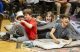 Theo Wake (Oliver Twist) with young comany members in Oliver! rehearsals. Photo by Pamela Raith
