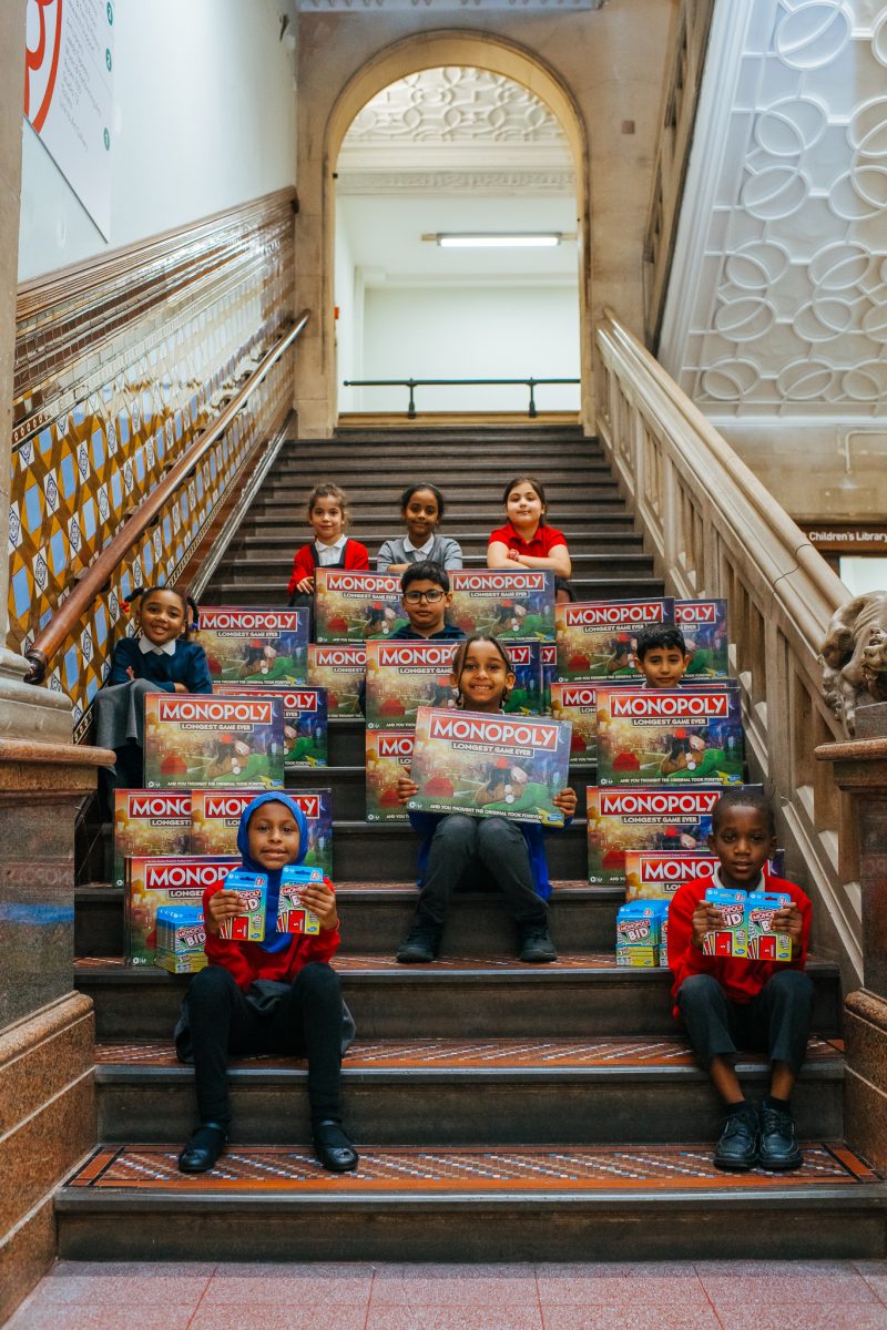 Children receive their MONOPOLY board games (1) (1)